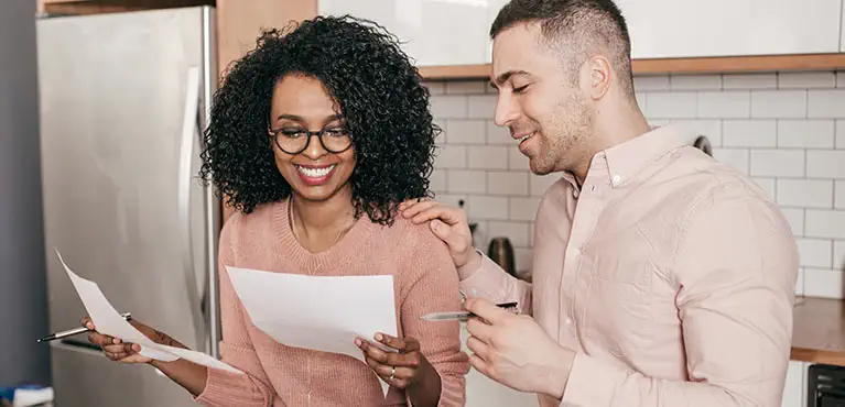 couple planning finances discussing investments