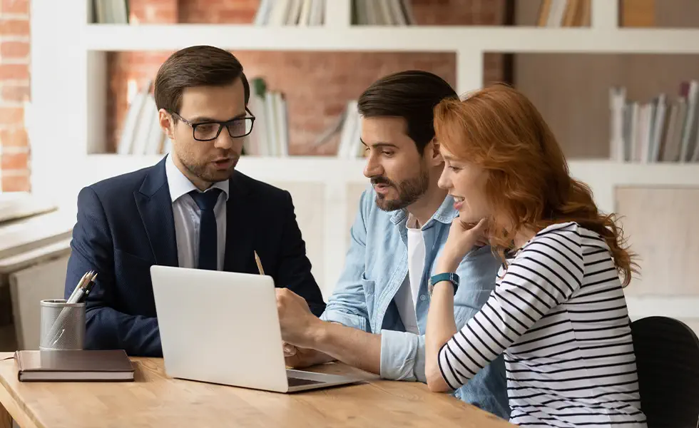 Financial professional talking with couple
