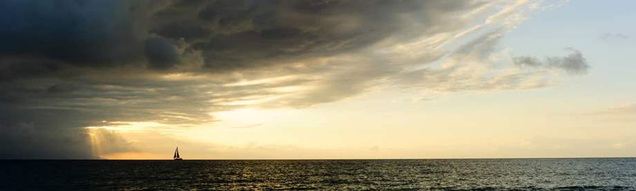 sailboat approaching storm